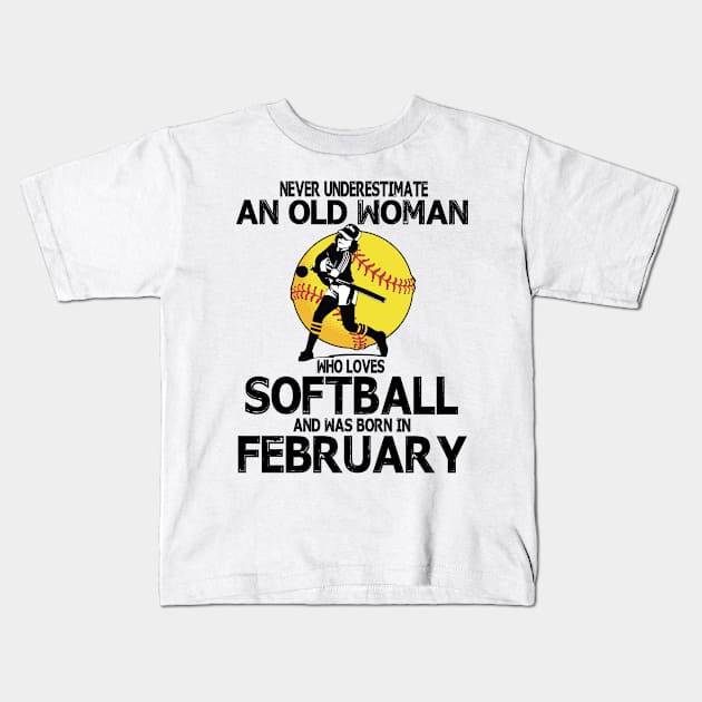 Never Underestimate A Woman Loves Softball Born In February Kids T-Shirt by Cowan79